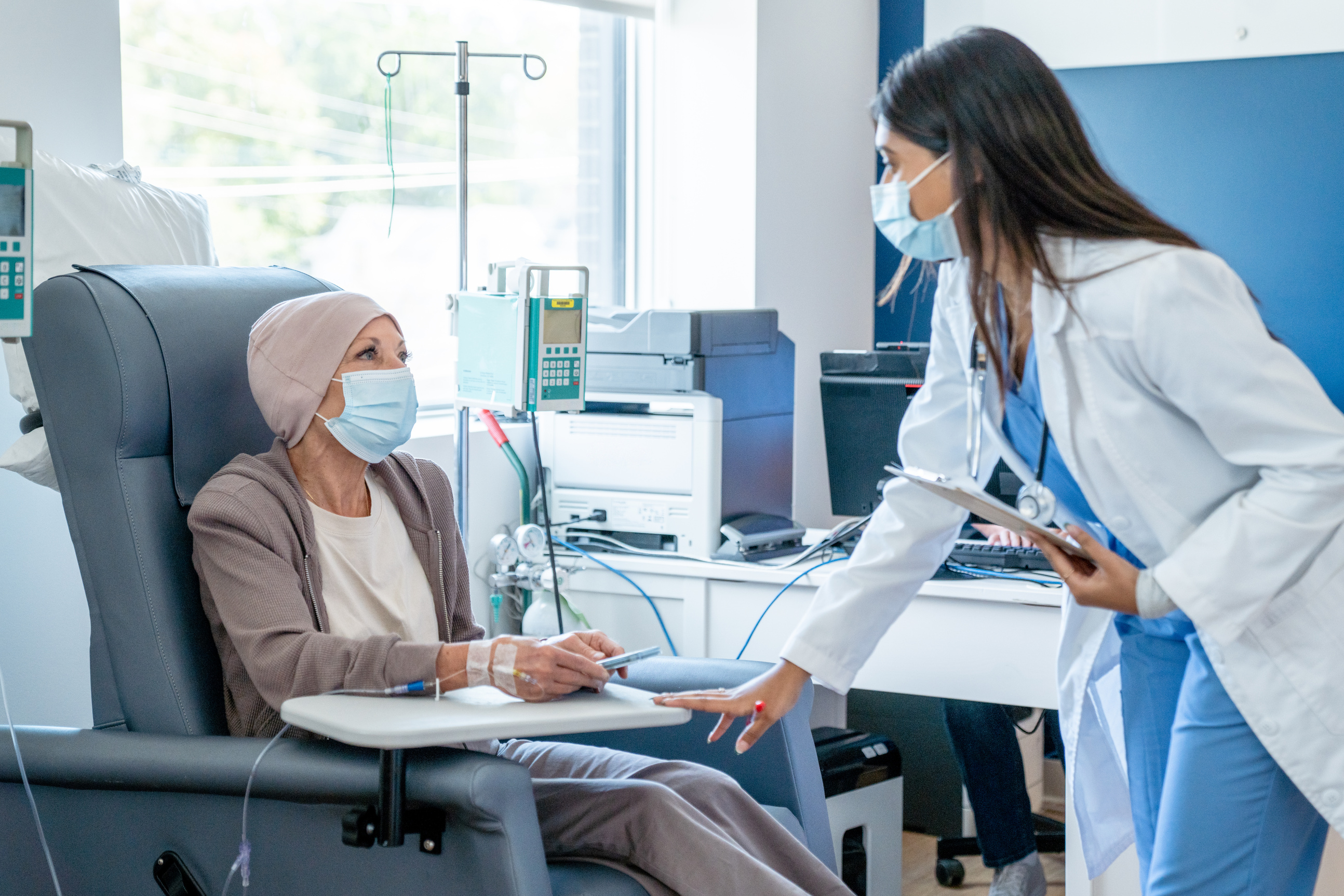 Chemotherapy patient discusses with her doctor